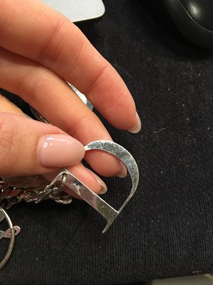 Lot 246 - A Christian Dior by John Galliano metal charm necklace, 2000s