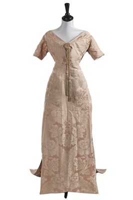 Lot 779 - A pink-grey damask satin evening gown, 1910-12