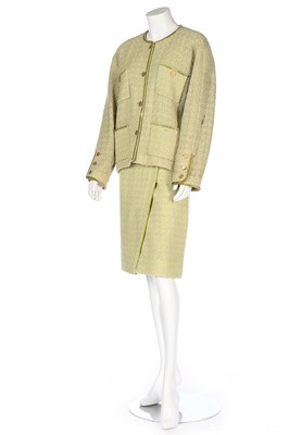 Lot 173 - A Chanel pale green tweed suit, probably 1990s,...