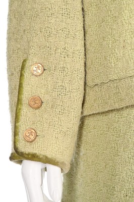 Lot 173 - A Chanel pale green tweed suit, probably 1990s,...