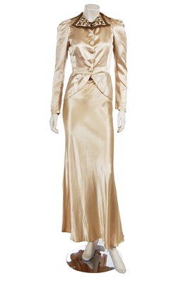 Lot 741 - A gold satin evening ensemble, circa 1935