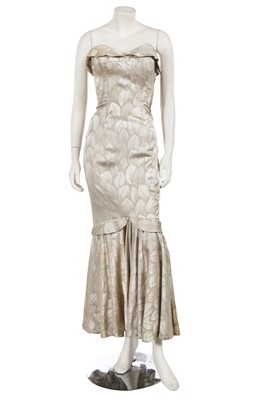Lot 730 - A Marcel Rochas gold lamé 'Siren' gown, circa 1951