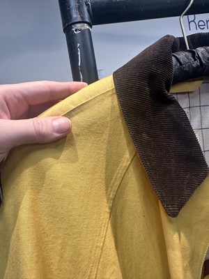 Lot 156 - An Hermès men's yellow cotton raincoat, 1970s