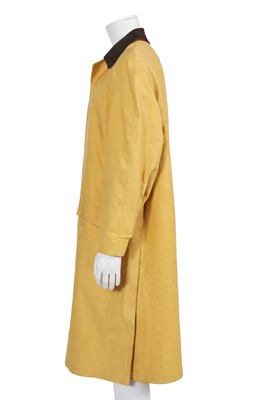 Lot 156 - An Hermès men's yellow cotton raincoat, 1970s