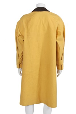 Lot 156 - An Hermès men's yellow cotton raincoat, 1970s
