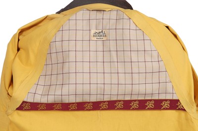 Lot 156 - An Hermès men's yellow cotton raincoat, 1970s