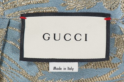 Lot 326 - A Gucci by Alessandro Michele blue and gold silk damask blouse, 2017