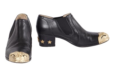 Lot 195 - A pair of Chanel by Karl Lagerfeld black leather boots, 'Paris-Dallas' collection, Métiers d'Art, Pre-Fall 2014