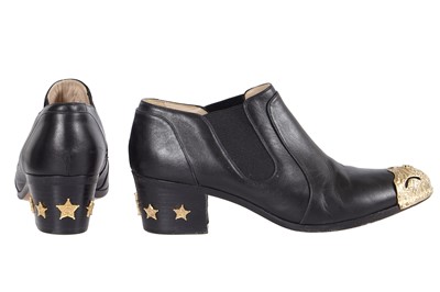 Lot 195 - A pair of Chanel by Karl Lagerfeld black leather boots, 'Paris-Dallas' collection, Métiers d'Art, Pre-Fall 2014