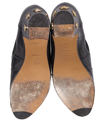 Lot 195 - A pair of Chanel by Karl Lagerfeld black leather boots, 'Paris-Dallas' collection, Métiers d'Art, Pre-Fall 2014
