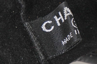 Lot 24 - A pair of Chanel by Karl Lagerfeld little black gloves, 2000s