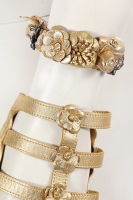 Lot 191 - A group of Chanel by Karl Lagerfeld gold leather accessories, ‘La Modernité de l’Antiquité’ collection, Cruise 2018