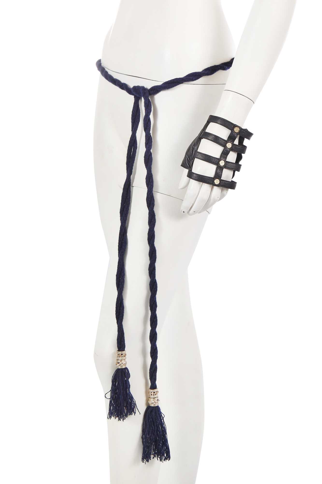 Lot 190 - A Chanel by Karl Lagerfeld blue wool belt and black leather mitts, ‘La Modernité de l’Antiquité’ collection, Cruise 2018