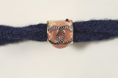 Lot 190 - A Chanel by Karl Lagerfeld blue wool belt and black leather mitts, ‘La Modernité de l’Antiquité’ collection, Cruise 2018