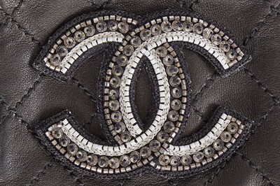 Lot 198 - Two pairs of Chanel by Karl Lagerfeld black quilt-effect lambskin glovelettes, 2000s-2010s