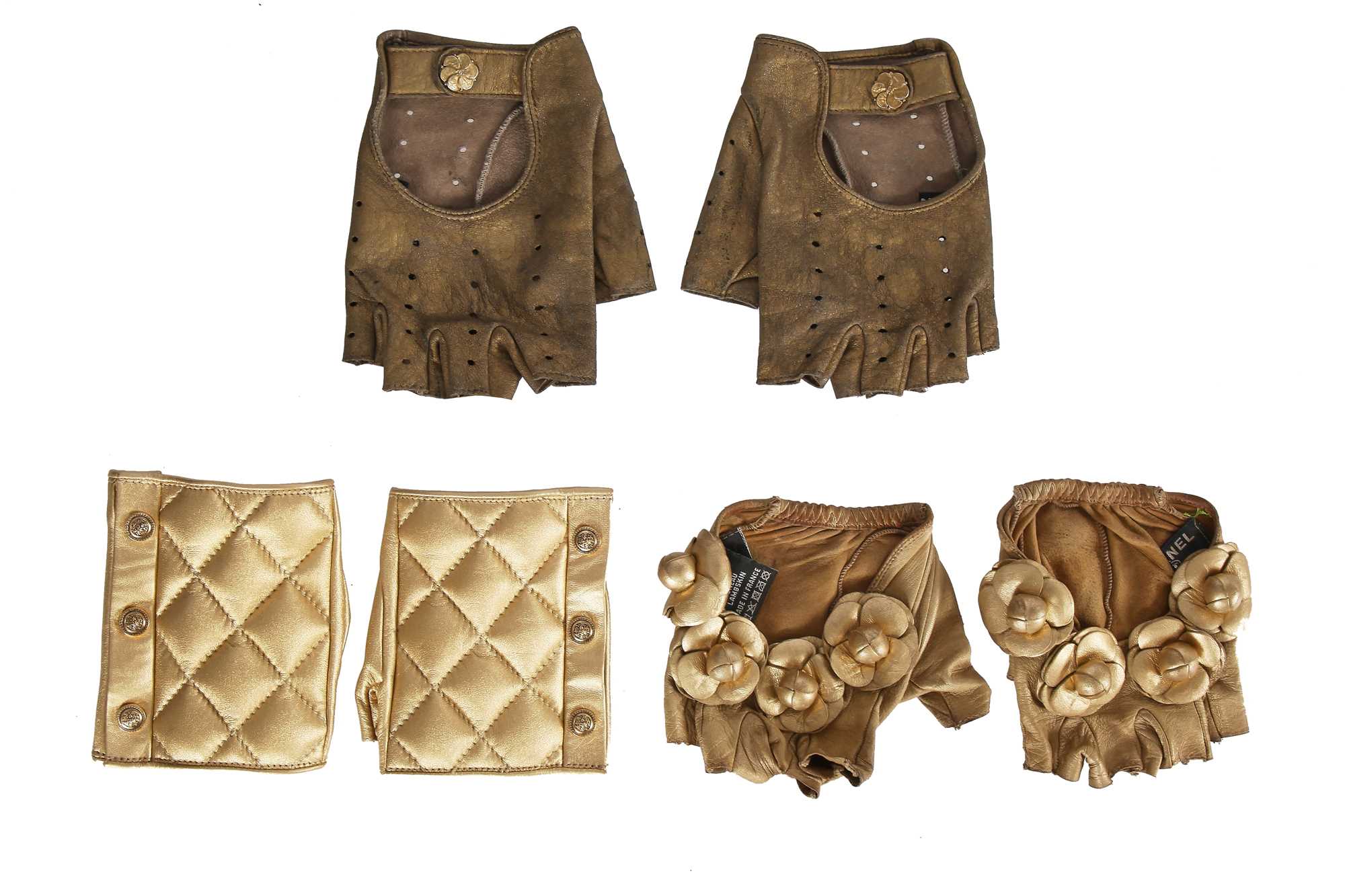 Lot 201 - Three pairs of Chanel by Karl Lagerfeld gold lambskin glovelettes, 2000s-2010s