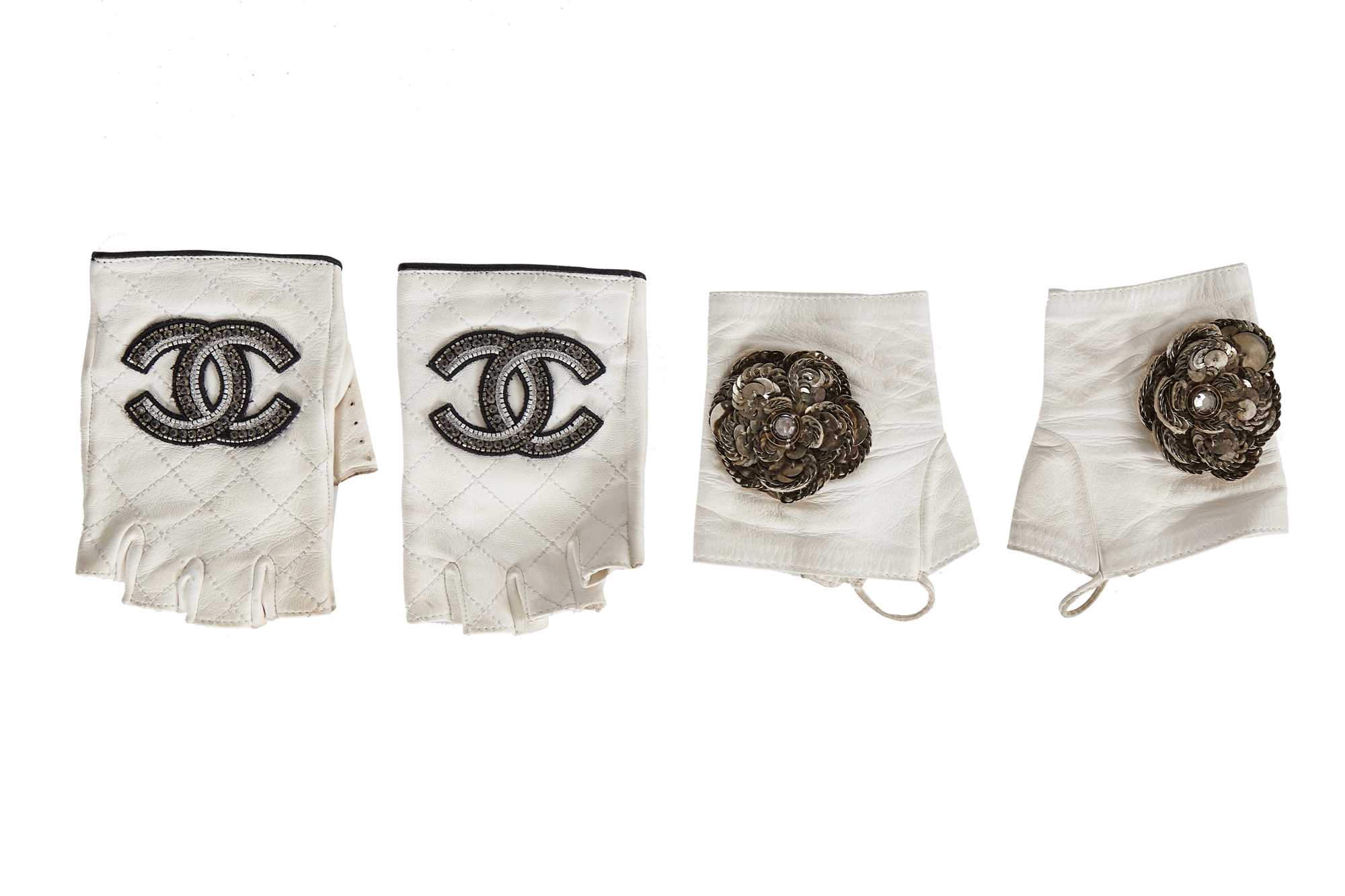 Lot 202 - Two pairs of Chanel by Karl Lagerfeld white lambskin glovelettes, 2000s-2010s
