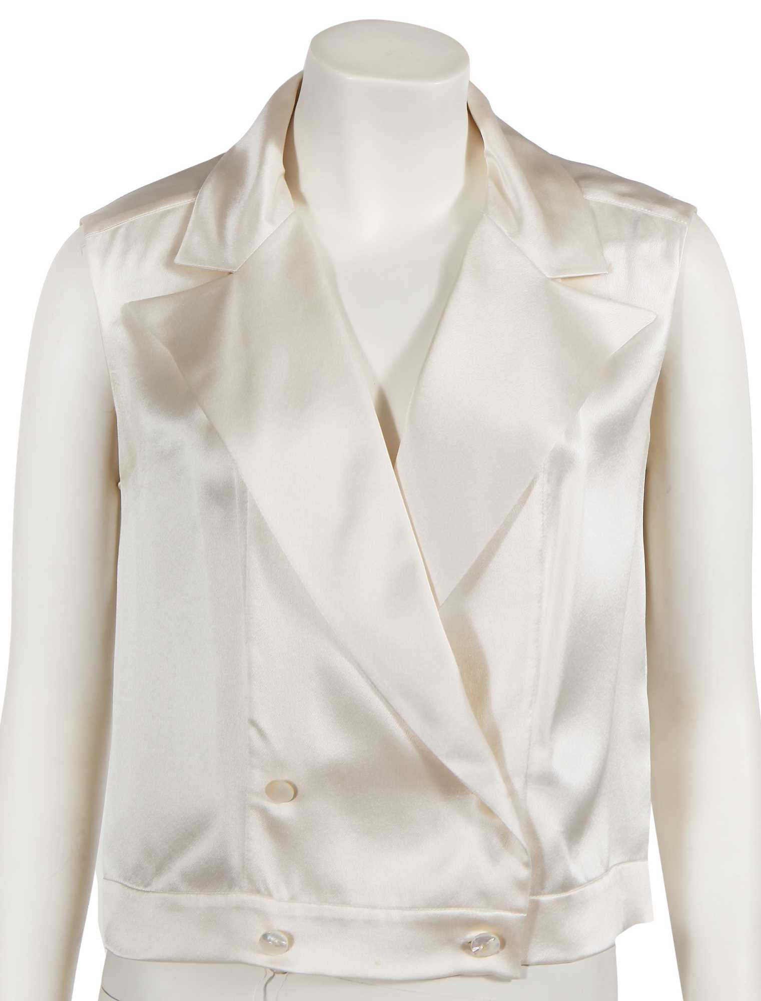 Lot 229 - Two Chanel by Karl Lagerfeld cream silk satin blouses, late 1990s