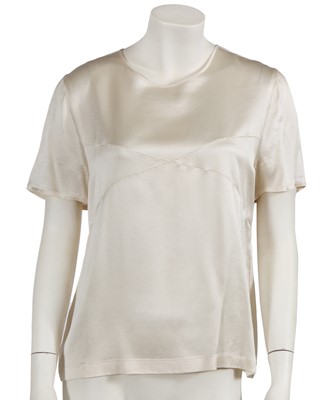 Lot 229 - Two Chanel by Karl Lagerfeld cream silk satin blouses, late 1990s