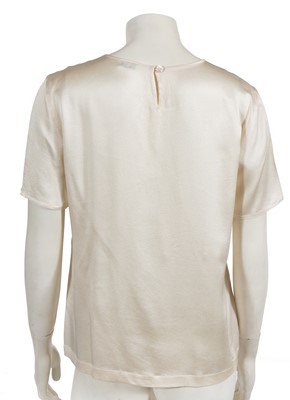 Lot 229 - Two Chanel by Karl Lagerfeld cream silk satin blouses, late 1990s