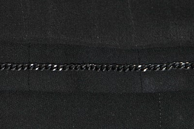 Lot 221 - A Chanel by Karl Lagerfeld black wool-blend crêpe suit, circa 2000