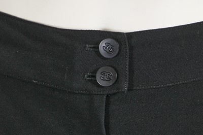 Lot 221 - A Chanel by Karl Lagerfeld black wool-blend crêpe suit, circa 2000