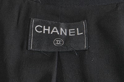 Lot 221 - A Chanel by Karl Lagerfeld black wool-blend crêpe suit, circa 2000