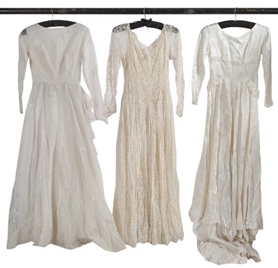 Lot 720 - A large group of wedding dresses, 1950s-1970s
