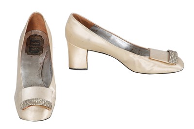 Lot 713 - A pair of Christian Dior cream satin pumps, circa 1965
