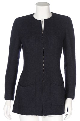 Lot 320 - Two Chanel navy boucle wool jackets, 1990s,...