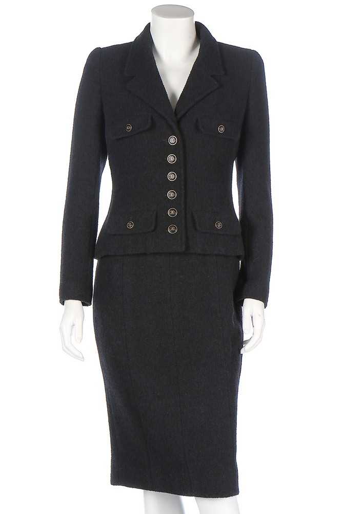 Lot 318 - A Chanel black wool suit, 1990s, boutique...