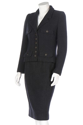 Lot 318 - A Chanel black wool suit, 1990s, boutique...