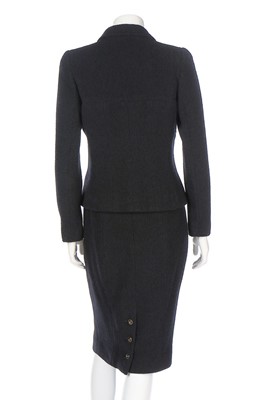 Lot 318 - A Chanel black wool suit, 1990s, boutique...