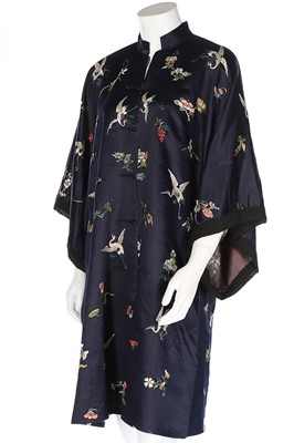 Lot 477 - A woman's embroidered navy satin informal robe,...