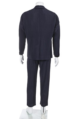 Lot 137 - An Issey Miyake Homme Plissé navy pleated polyester suit, circa 2017