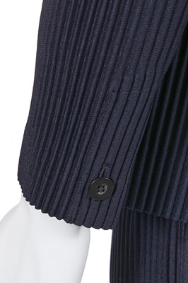 Lot 137 - An Issey Miyake Homme Plissé navy pleated polyester suit, circa 2017
