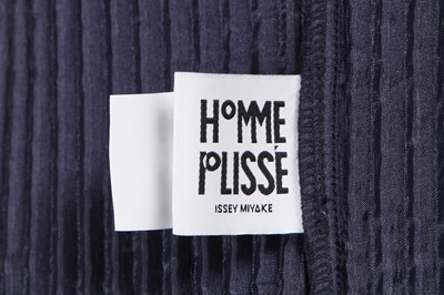 Lot 137 - An Issey Miyake Homme Plissé navy pleated polyester suit, circa 2017