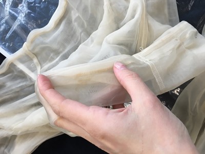 Lot 213 - A Maison Martin Margiela ivory nylon mesh ensemble, Spring-Summer 1990