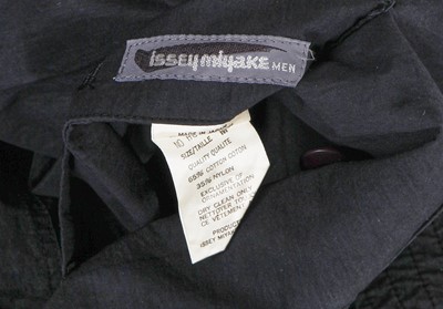 Lot 124 - An Issey Miyake men's navy cotton-blend convertible waistcoat/bag, 1988
