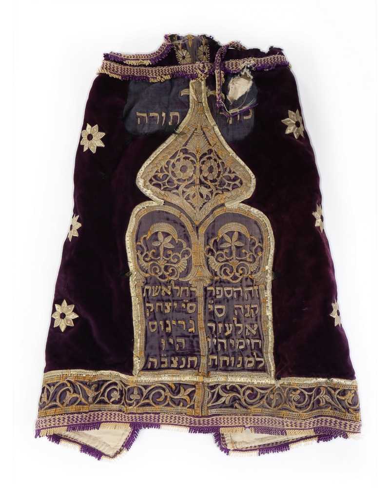 Lot 453 - An embroidered purple velvet torah cover,...