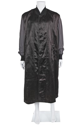 Lot 121 - A Comme des Garçons black satin staff coat, Spring-Summer 1986