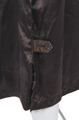 Lot 121 - A Comme des Garçons black satin staff coat, Spring-Summer 1986