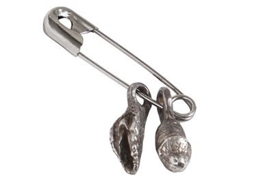 Lot 361 - A rare pair of Westwood/McLaren Sex metal genitalia earring pendants, 1976