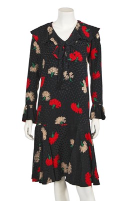 Lot 628 - An Yves Saint Laurent printed black silk dress, circa 1988