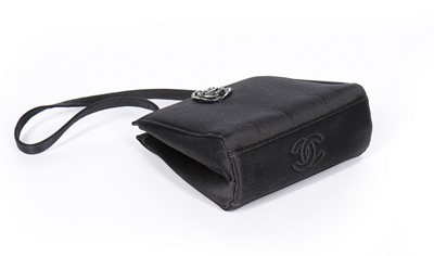 Lot 122 - A Chanel black satin evening bag with matching...