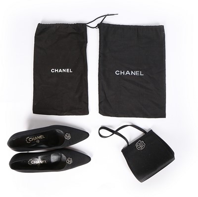 Lot 122 - A Chanel black satin evening bag with matching...