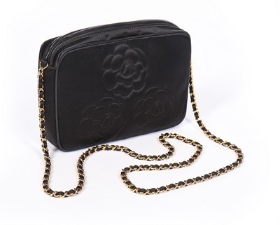 Lot 123 - A Chanel black satin shoulder bag, 1990s,...