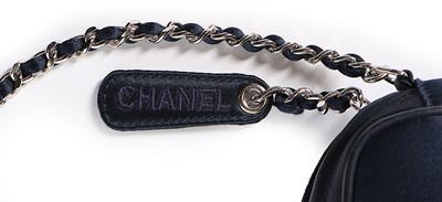 Lot 124 - A Chanel navy satin shoulder bag, 1990s,...