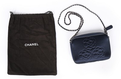 Lot 124 - A Chanel navy satin shoulder bag, 1990s,...