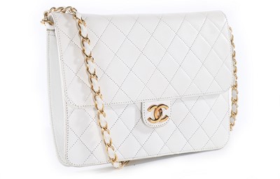 Lot 208 - A Chanel quilted white leather bag, 1990s,...